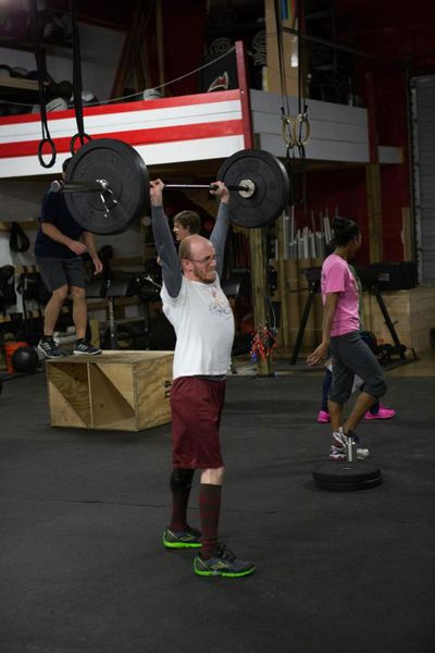 Dave performs push presses during the 2013 CrossFit Games.